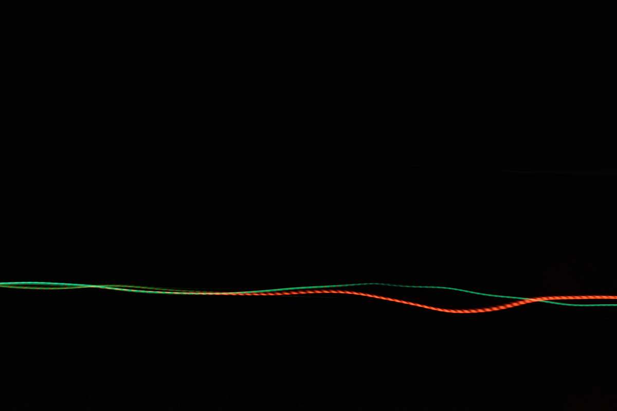 long exposure gray and red wavy lines green